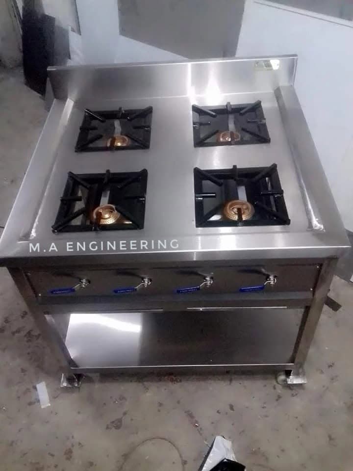 M A Engineering four-burner stainless steel gas stove